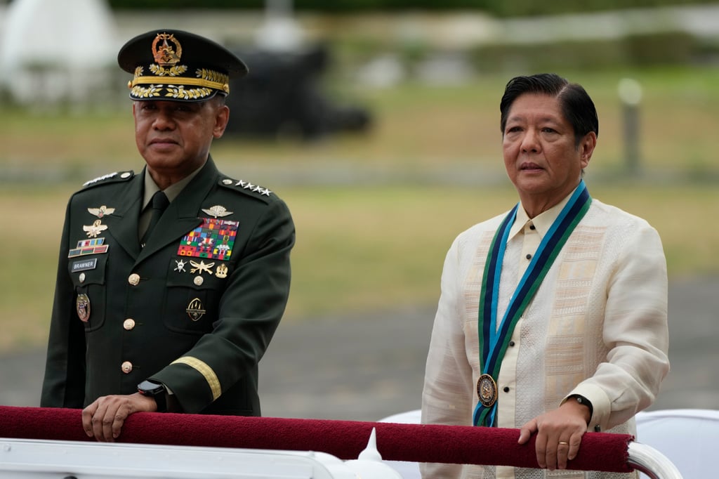 Philippine President Ferdinand Marcos Jnr (right) and military chief Romeo Brawner Jnr review troops at Camp Aguinaldo in Quezon City on December 20, 2024. Photo: AP Philippine President Ferdinand Marcos Jnr (right) and military chief Romeo Brawner Jnr review troops at Camp Aguinaldo in Quezon City on December 20, 2024. Photo: AP