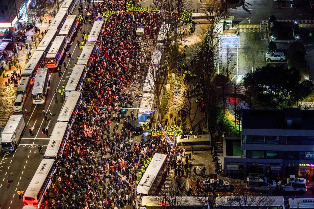 Pro-Yoon supporters gather outside the Seoul Western District Court on Saturday. Photo: AFP Pro-Yoon supporters gather outside the Seoul Western District Court on Saturday. Photo: AFP