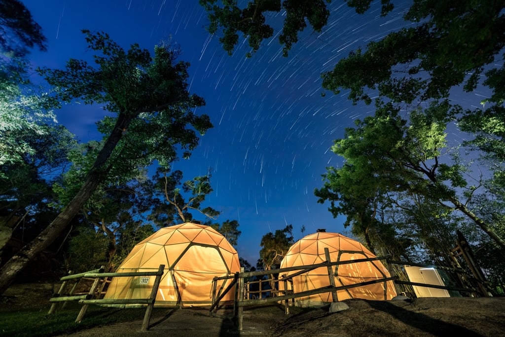 A night sky with star trails over two domed tents in Hong Kong. Photo: Getty Images A night sky with star trails over two domed tents in Hong Kong. Photo: Getty Images