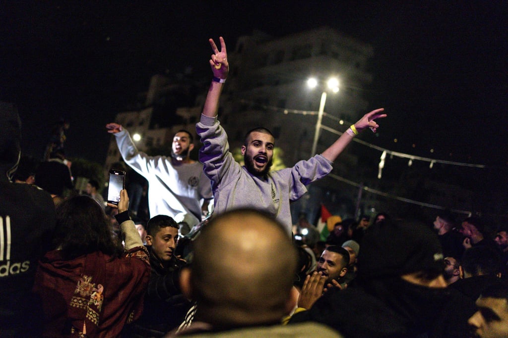 Palestinian prisoners set free by Israel celebrate upon their arrival in the occupied West Bank town of Beitunia. Photo: AFP Palestinian prisoners set free by Israel celebrate upon their arrival in the occupied West Bank town of Beitunia. Photo: AFP