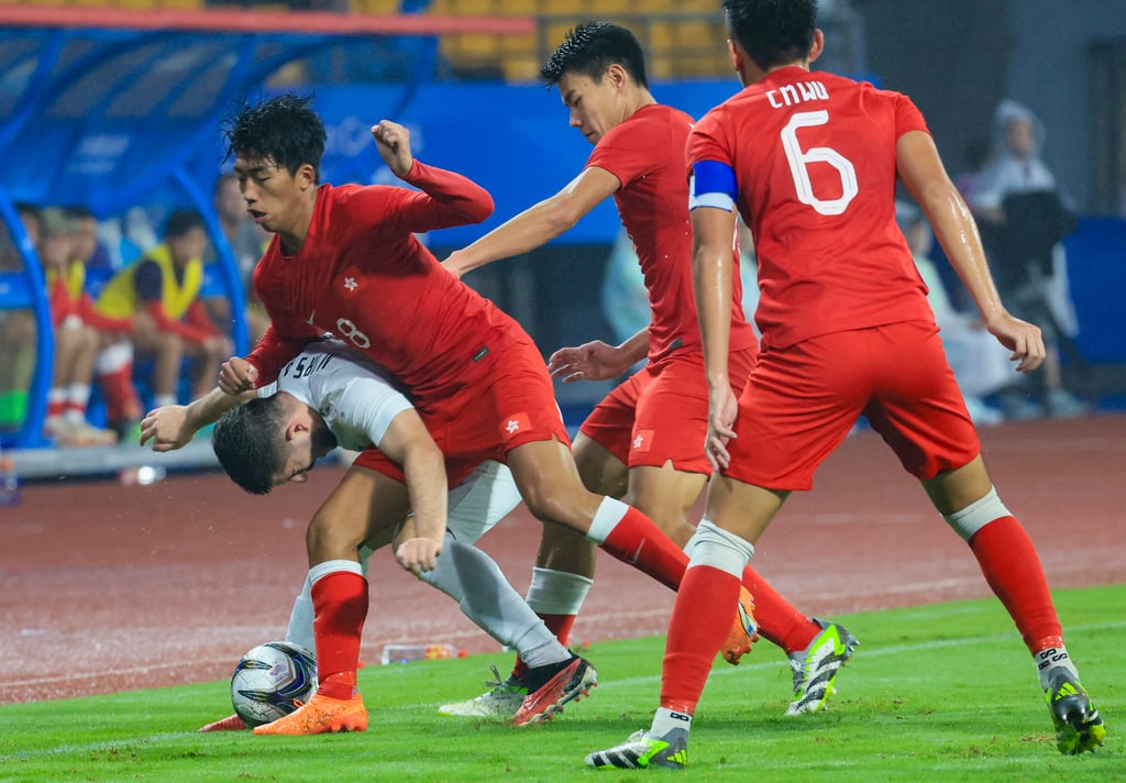 Wong challenges Saidazamat Mirsaidov during an Asian Games clash with Uzbekistan. Photo: Dickson Lee