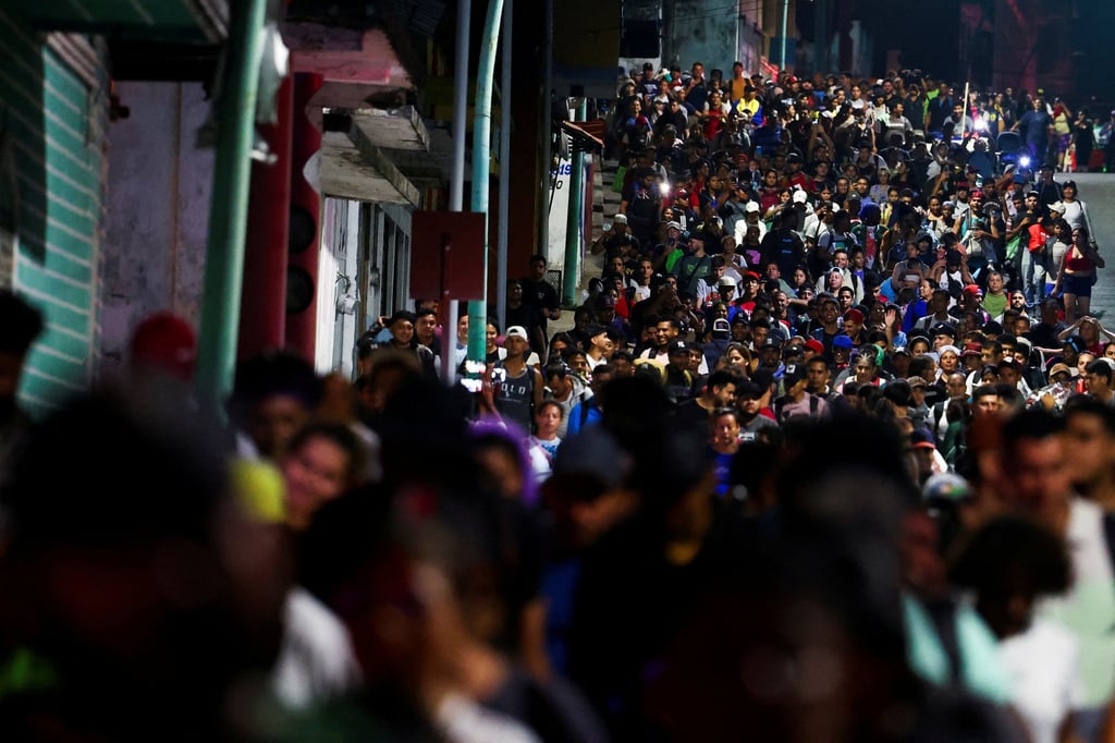 Migrants walk in a caravan bound for the northern border with the US, in Tapachula, Chiapas state, Mexico. Photo: Reuters Migrants walk in a caravan bound for the northern border with the US, in Tapachula, Chiapas state, Mexico. Photo: Reuters
