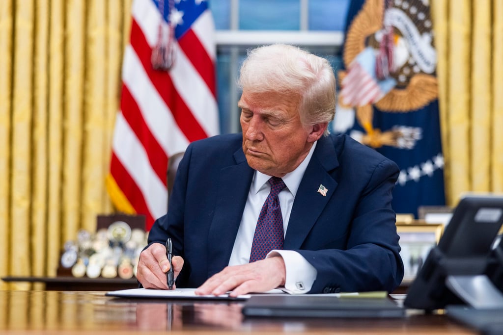 US President Donald Trump signs numerous executive orders, including a delay on enforcing a ban on TikTok, in the Oval Office of the White House on January 20. Photo: EPA-EFE US President Donald Trump signs numerous executive orders, including a delay on enforcing a ban on TikTok, in the Oval Office of the White House on January 20. Photo: EPA-EFE