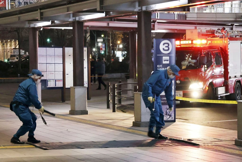 Members of police exam the scene of a multiple stabbing in front of JR Nagano station. Photo: AP Members of police exam the scene of a multiple stabbing in front of JR Nagano station. Photo: AP