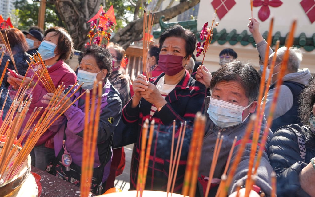 People pray for fortune in the coming year at Wong Tai Sin Temple in Hong Kong. Photo: Elson Li People pray for fortune in the coming year at Wong Tai Sin Temple in Hong Kong. Photo: Elson Li