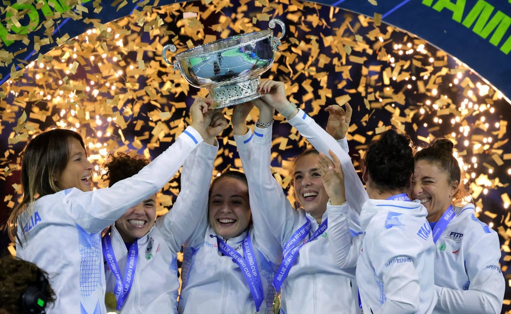The Italy team celebrate winning the Billie Jean King Cup in Malaga in 2004. Photo: Reuters The Italy team celebrate winning the Billie Jean King Cup in Malaga in 2004. Photo: Reuters