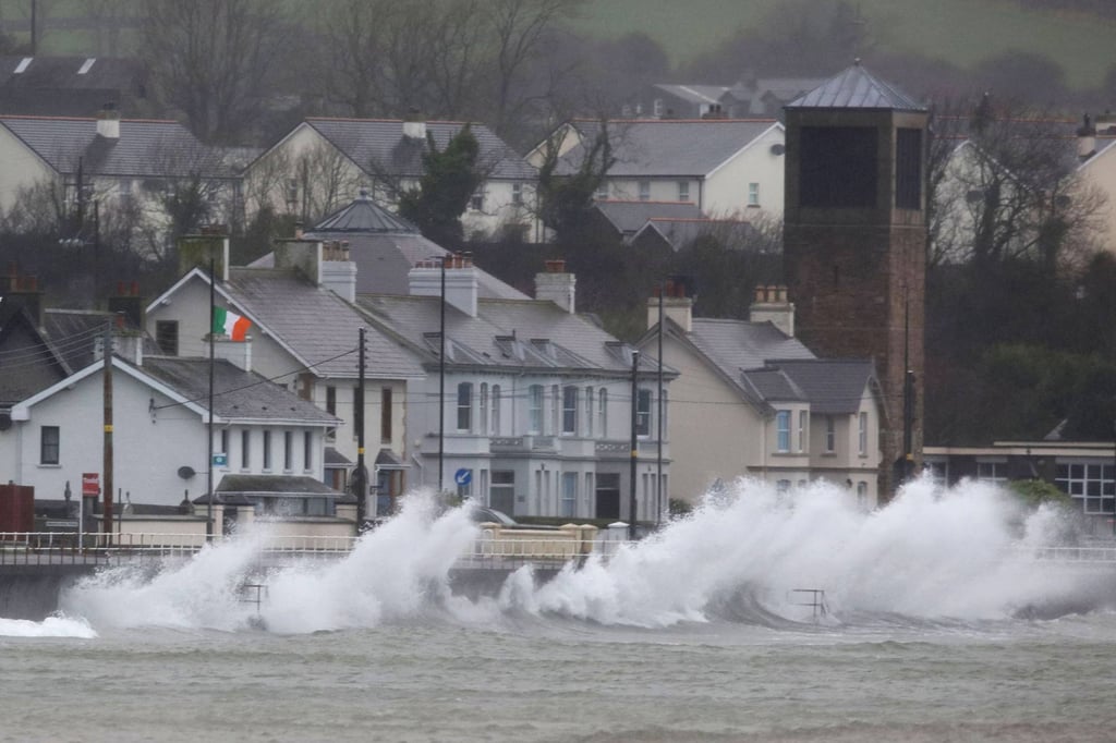 Waves break against a sea wall on the northeast coast of Northern Ireland on Friday. A rare red warning for wind was issued by the Met Office for Northern Ireland and Scotland. Photo: AFP