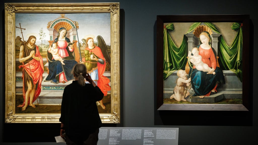 From left: Madonna Enthroned with the Blessing Child, John the Baptist and St. Michael the Archangel (circa 1490-95), by Francesco Granacci, and Enthroned Madonna with Child and St John the Baptist (1519), also by Granacci, at the Berlin exhibition. Photo: EPA-EFE