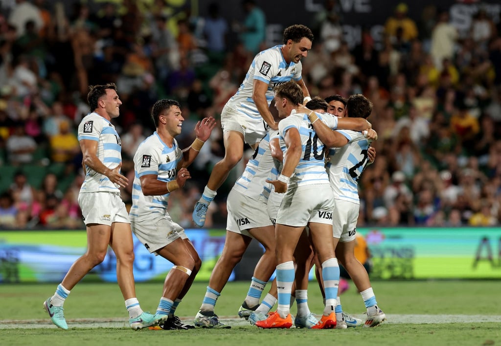 Argentina’s men celebrate after their thumping rugby sevens victory over hosts Australia at the Perth Sevens. Photo: Reuters
