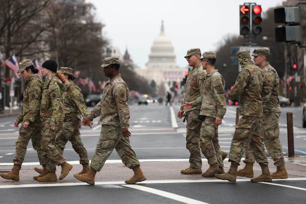 US Army soldiers walk in front of the US Capitol Building in Washington on January 18. Photo: Getty Images via AFP US Army soldiers walk in front of the US Capitol Building in Washington on January 18. Photo: Getty Images via AFP