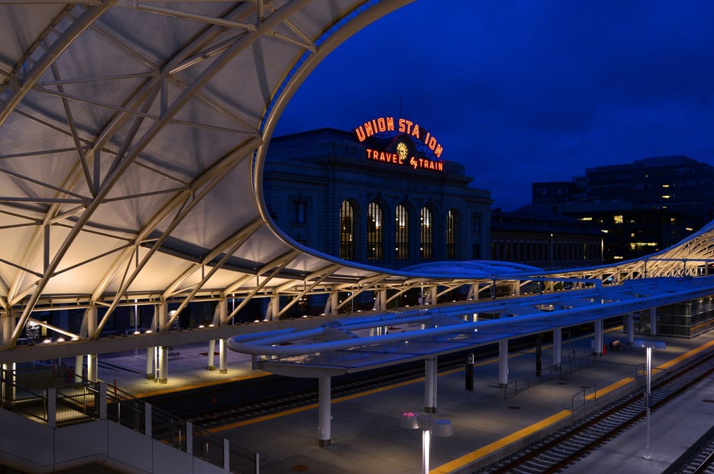 The classic neon light of the sign above Union Station in Denver contrasts with the modern station platform area. Photo: Shutterstock The classic neon light of the sign above Union Station in Denver contrasts with the modern station platform area. Photo: Shutterstock