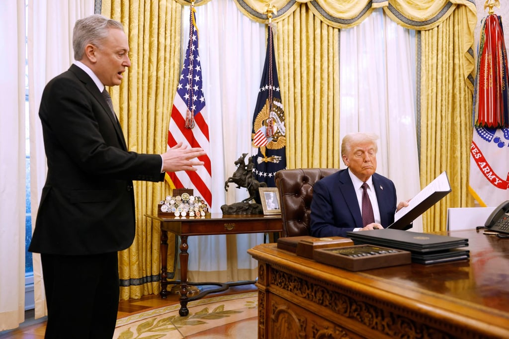 David Sacks speaks to President Trump as he signs a series of executive orders in the Oval Office of the White House on January 23, 2025. Photo: AFP David Sacks speaks to President Trump as he signs a series of executive orders in the Oval Office of the White House on January 23, 2025. Photo: AFP