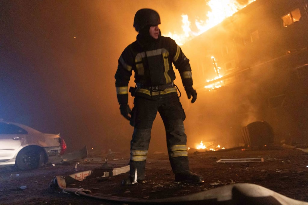 A firefighter looks on as flames erupt from a building in Ukraine following a Russian strike on Tuesday. Photo: Zuma Press Wire/dpa A firefighter looks on as flames erupt from a building in Ukraine following a Russian strike on Tuesday. Photo: Zuma Press Wire/dpa