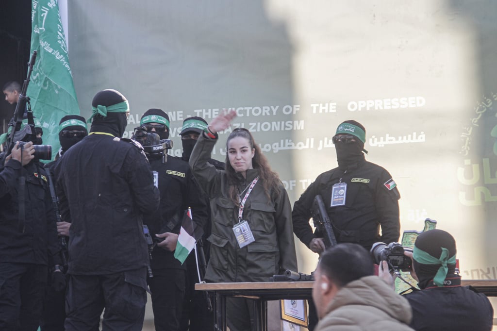 Hamas militants surround Israeli soldier Agam Berger before they hand her over to the Red Cross. Photo: dpa Hamas militants surround Israeli soldier Agam Berger before they hand her over to the Red Cross. Photo: dpa