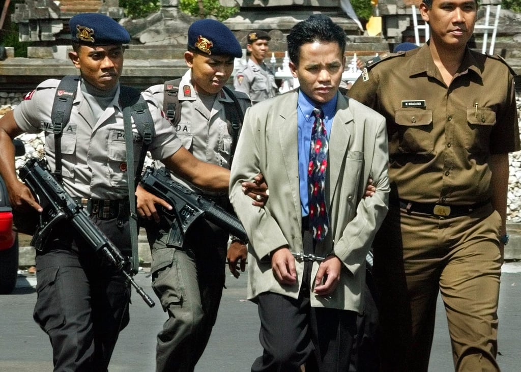 Ali Imron leaving the courtroom after his first trial, in Bali, Indonesia, in 2003. He was eventually sentenced to life for his role in the 2002 Bali bombings. Photo: AP