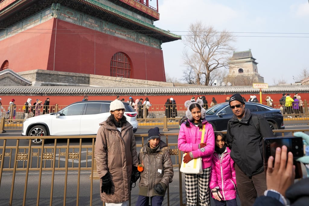 A family from Malaysia poses for photos in Beijing on Friday. Photo: Xinhua A family from Malaysia poses for photos in Beijing on Friday. Photo: Xinhua