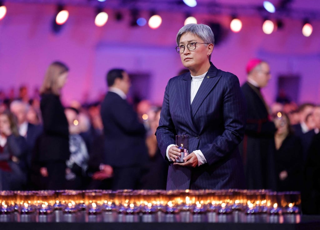Australian Foreign Minister Penny Wong places a candle to pay tribute to victims at an event in Poland last month commemorating the 80th anniversary of the liberation of Nazi concentration and extermination camps. Photo: AFP Australian Foreign Minister Penny Wong places a candle to pay tribute to victims at an event in Poland last month commemorating the 80th anniversary of the liberation of Nazi concentration and extermination camps. Photo: AFP