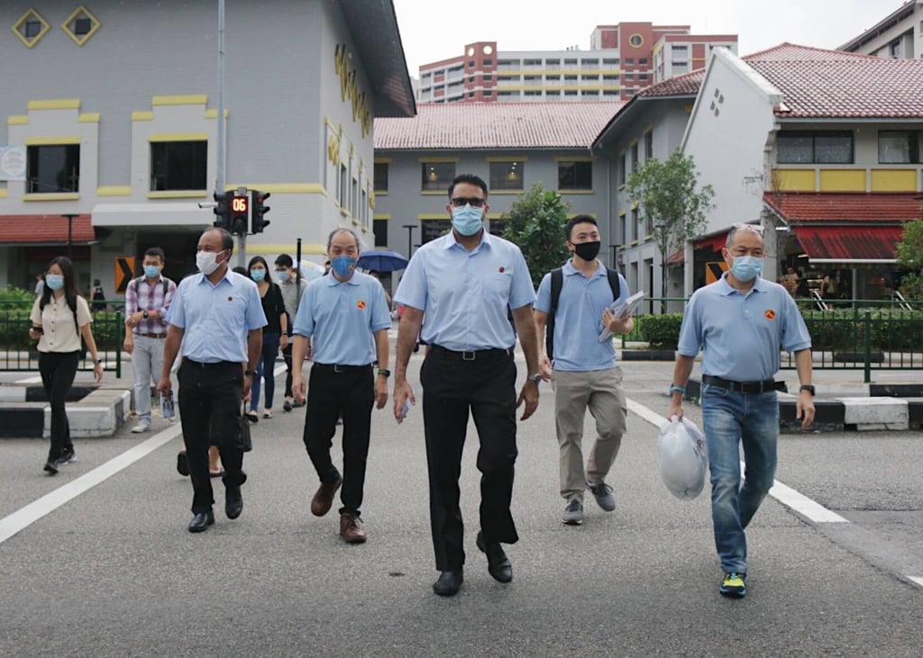 Pritam Singh (centre) with former Workers’ Party chief Low Thia Khiang (fourth from right) and party members at their Aljunied stronghold in the lead-up to the July 10, 2020 election. Photo: Dewey Sim Pritam Singh (centre) with former Workers’ Party chief Low Thia Khiang (fourth from right) and party members at their Aljunied stronghold in the lead-up to the July 10, 2020 election. Photo: Dewey Sim