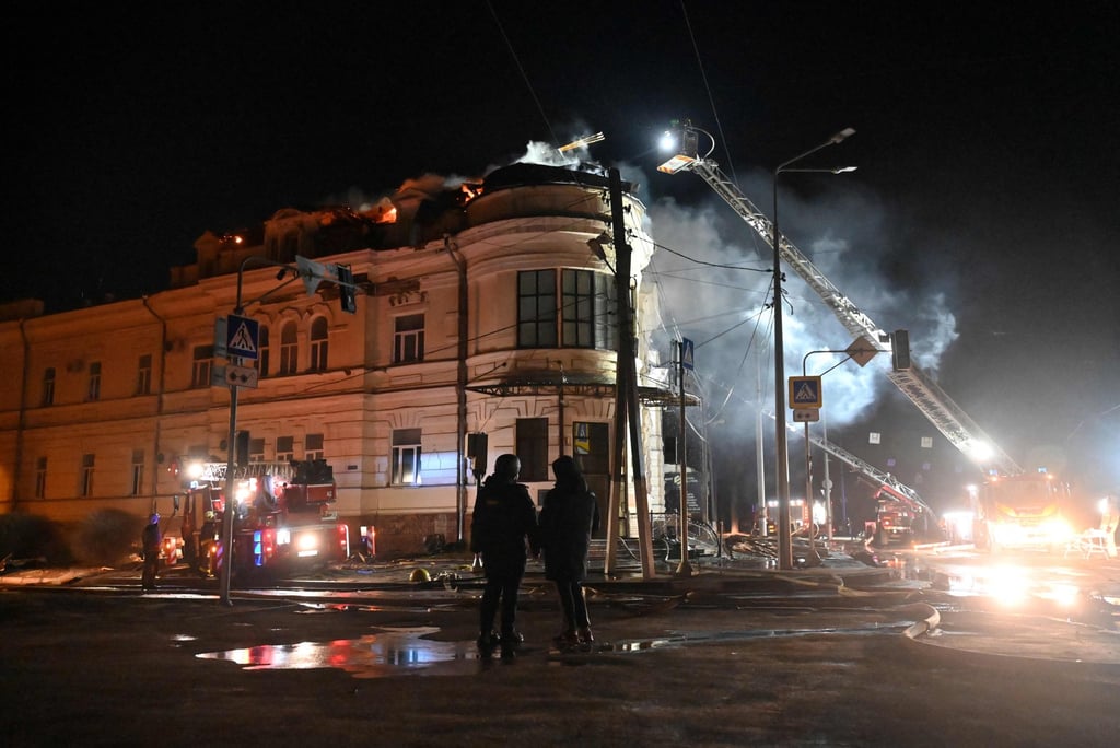 Ukrainian firefighters try to put out a fire after a drone strike in Kharkiv on February 5. Putin has recently said he is willing to negotiate, but that Zelensky has blocked any talks with him. Photo: AFP