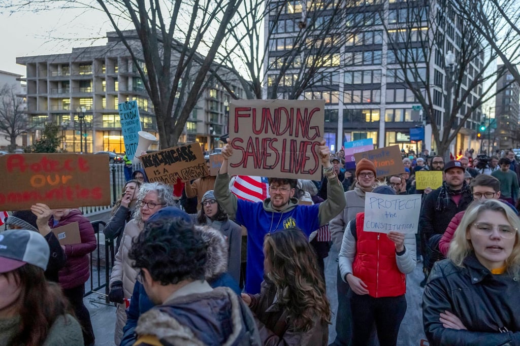People protest against a funding freeze of federal grants and loans in Washington on January 28. Photo: AP People protest against a funding freeze of federal grants and loans in Washington on January 28. Photo: AP