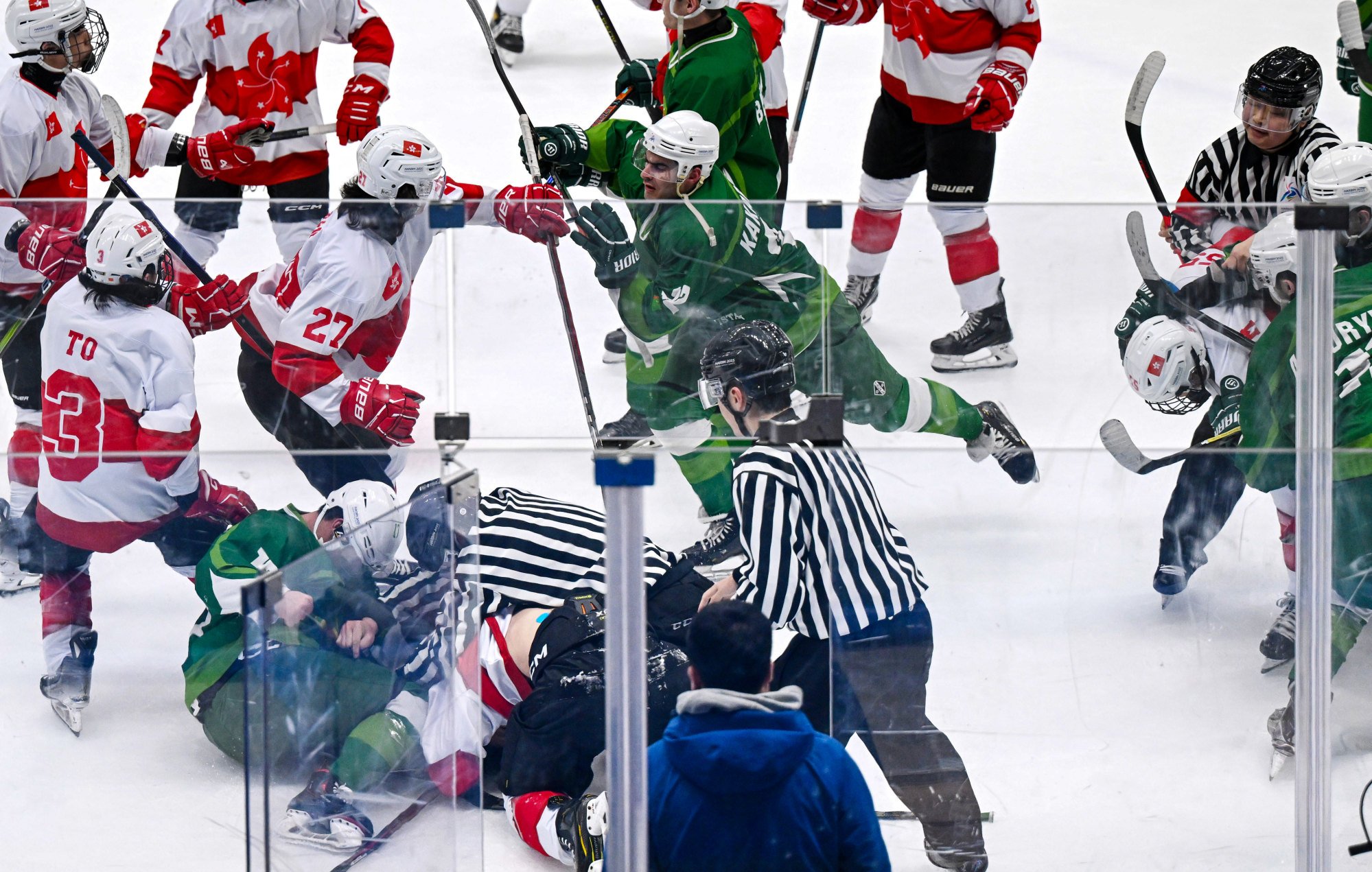 Hong Kong players (red and white) in a scuffle with the Turkmenistan team after their 5-1 win. Photo: Xinhua