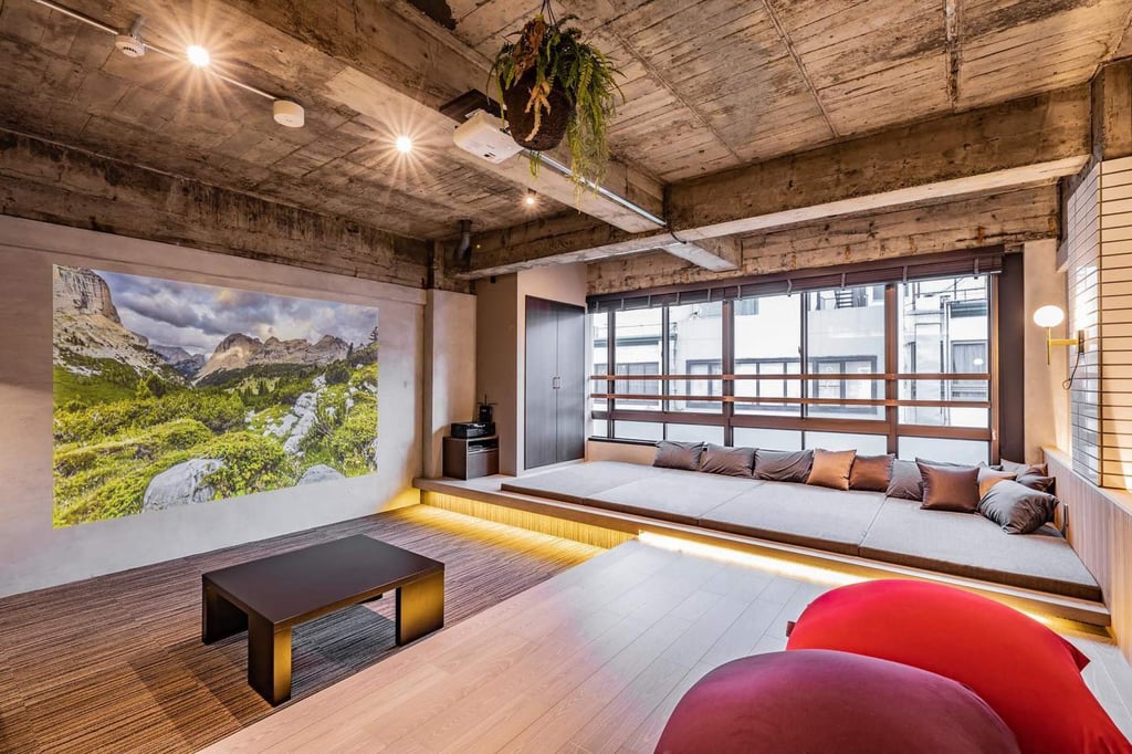 The lounge area of a vacant commercial space converted into guest accommodation. Some rooms have cushions made from Enshu textiles traditionally woven in western Shizuoka prefecture. Photo: Instagram/birupaku_shizuoka The lounge area of a vacant commercial space converted into guest accommodation. Some rooms have cushions made from Enshu textiles traditionally woven in western Shizuoka prefecture. Photo: Instagram/birupaku_shizuoka