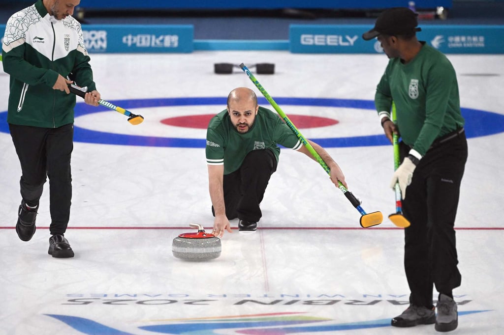 Suleiman Alaqel (centre) releases a stone during the curling loss to Hong Kong. Photo: AFP Suleiman Alaqel (centre) releases a stone during the curling loss to Hong Kong. Photo: AFP