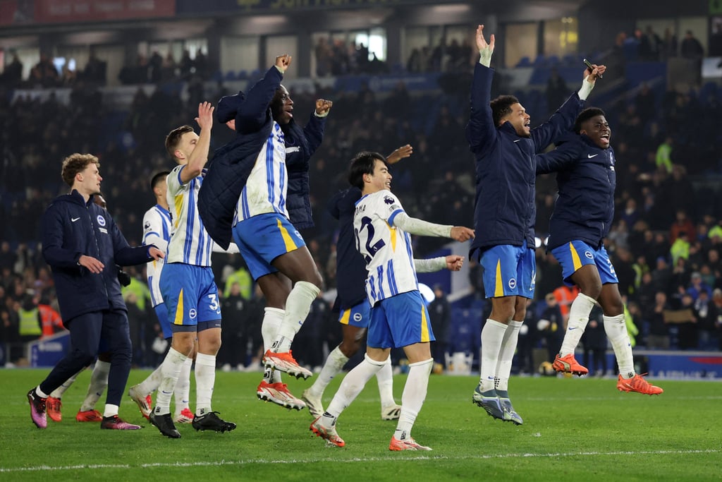 Brighton players celebrate with their supporters after handing visiting Chelsea a heavy defeat. Photo: Reuters