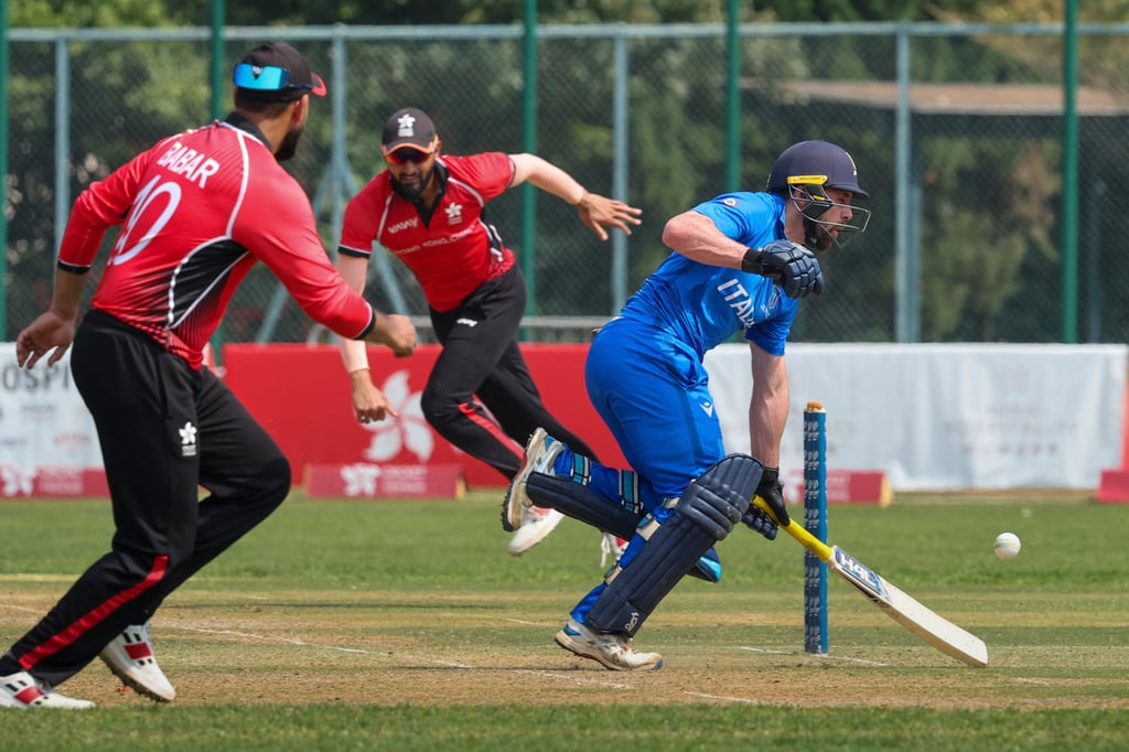 Hong Kong try to run out Marcus Campopiano (right) in the match at Tin Kwong Road. Photo: Dickson Lee