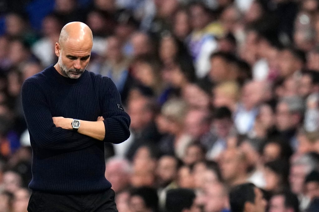 Manchester City’s head coach Pep Guardiola cuts a disconsolate figure in Madrid. Photo: AP Manchester City’s head coach Pep Guardiola cuts a disconsolate figure in Madrid. Photo: AP