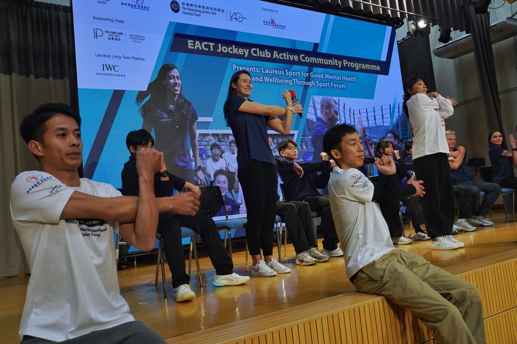 Siobhan Haughey, jockey Matthew Poon Ming-fai (left) and boxer Rex Tso Sing-yu lead a stretch. Photo: Elson Li Siobhan Haughey, jockey Matthew Poon Ming-fai (left) and boxer Rex Tso Sing-yu lead a stretch. Photo: Elson Li