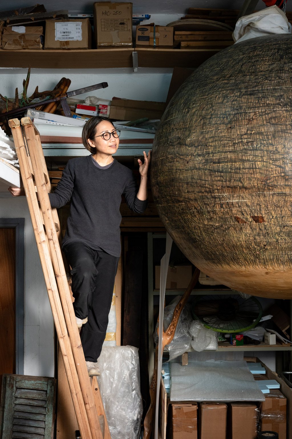 Jaffa Lam poses with one of her installation works at her studio. Photo: Eugene Chan