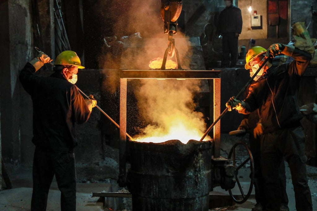 Steel workers in the Zhejiang provincial capital of Hangzhou in eastern China on January 11, 2022. Photo: AFP. Steel workers in the Zhejiang provincial capital of Hangzhou in eastern China on January 11, 2022. Photo: AFP.