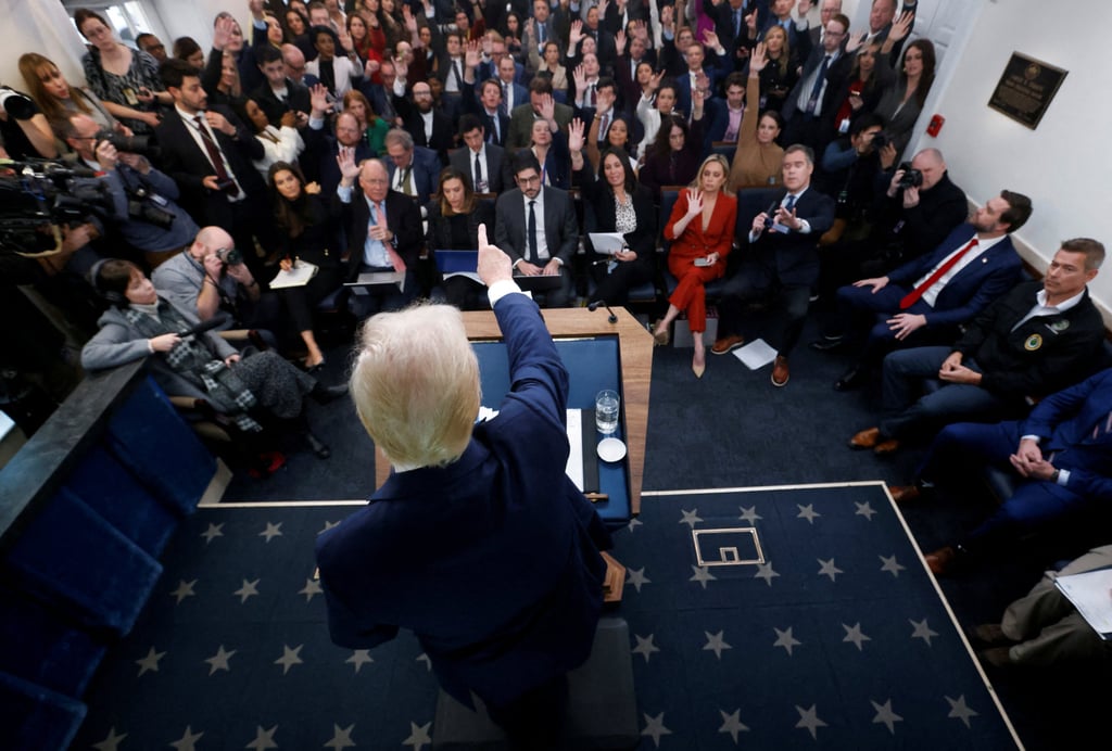 US President Donald Trump taking questions from reporters. Photo: Reuters