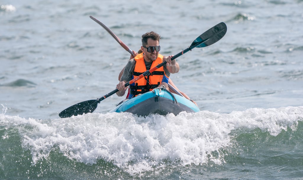 Four Peaks Race runners need to kayak from the sailboat to the beach before they start running. Photo: Alexander Mak Four Peaks Race runners need to kayak from the sailboat to the beach before they start running. Photo: Alexander Mak