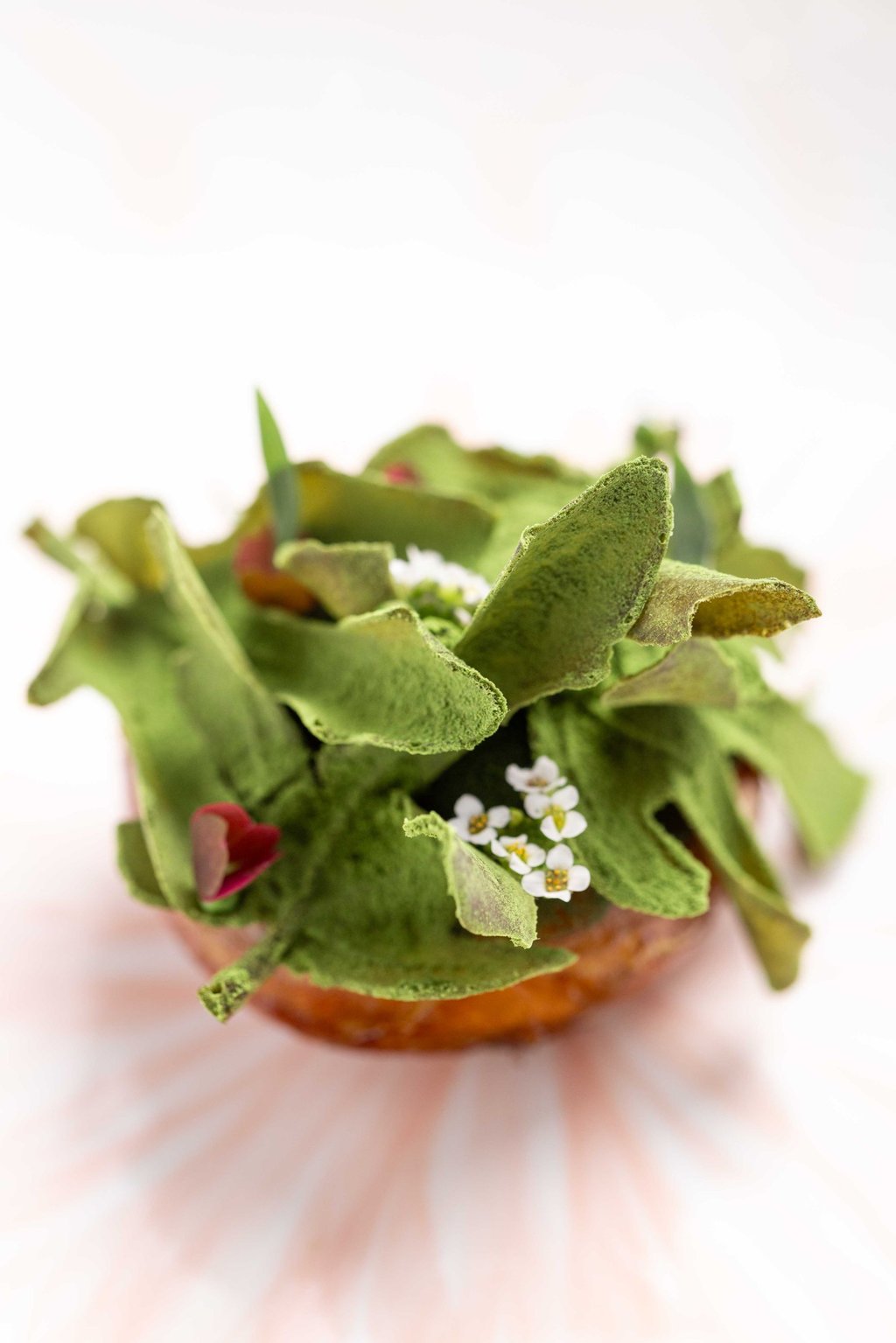 Camus artichoke roasted and glaze with saké Figs leaves and LongJing beurre blanc. Photo: Cristal Room by Anne-Sophie Pic