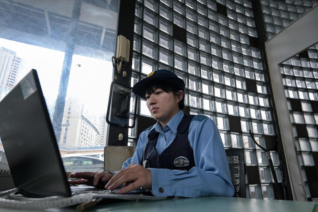 A police officer working inside a “koban”, or police box, in the Iidabashi area of central Tokyo. Photo: AFP A police officer working inside a “koban”, or police box, in the Iidabashi area of central Tokyo. Photo: AFP