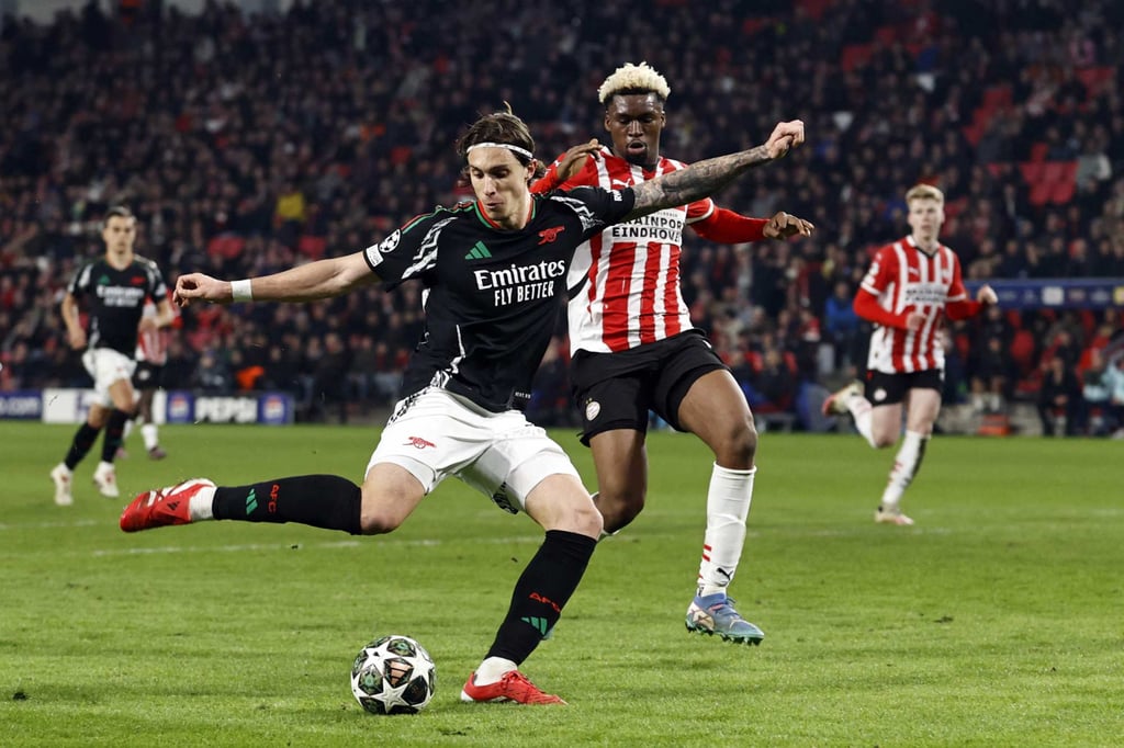 Arsenal defender Riccardo Calafiori (left) scores his side’s seventh goal against PSV. Photo: AFP Arsenal defender Riccardo Calafiori (left) scores his side’s seventh goal against PSV. Photo: AFP