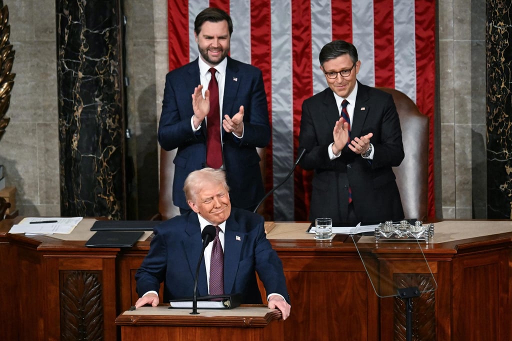 US Vice-President J.D. Vance (top left) and Speaker of the House Mike Johnson applaud as US President Donald Trump arrives to address a joint session of Congress in Washington on March 4. Photo: TNS US Vice-President J.D. Vance (top left) and Speaker of the House Mike Johnson applaud as US President Donald Trump arrives to address a joint session of Congress in Washington on March 4. Photo: TNS