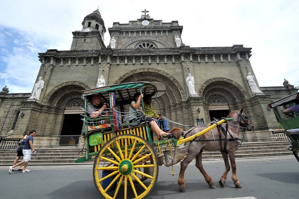 Tourists at the Manila Cathedral in Intramuros in Manila. Photo: AFP Tourists at the Manila Cathedral in Intramuros in Manila. Photo: AFP