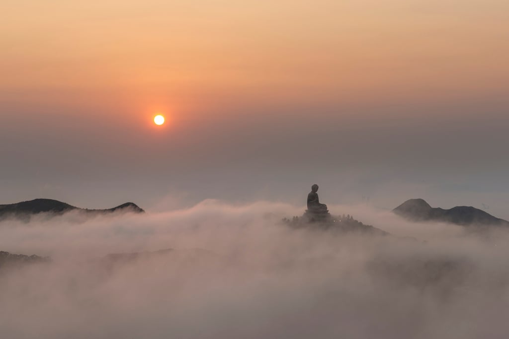 Tian Tan Buddha on Lantau Island, surrounded by fog. Photo: Edward Tin