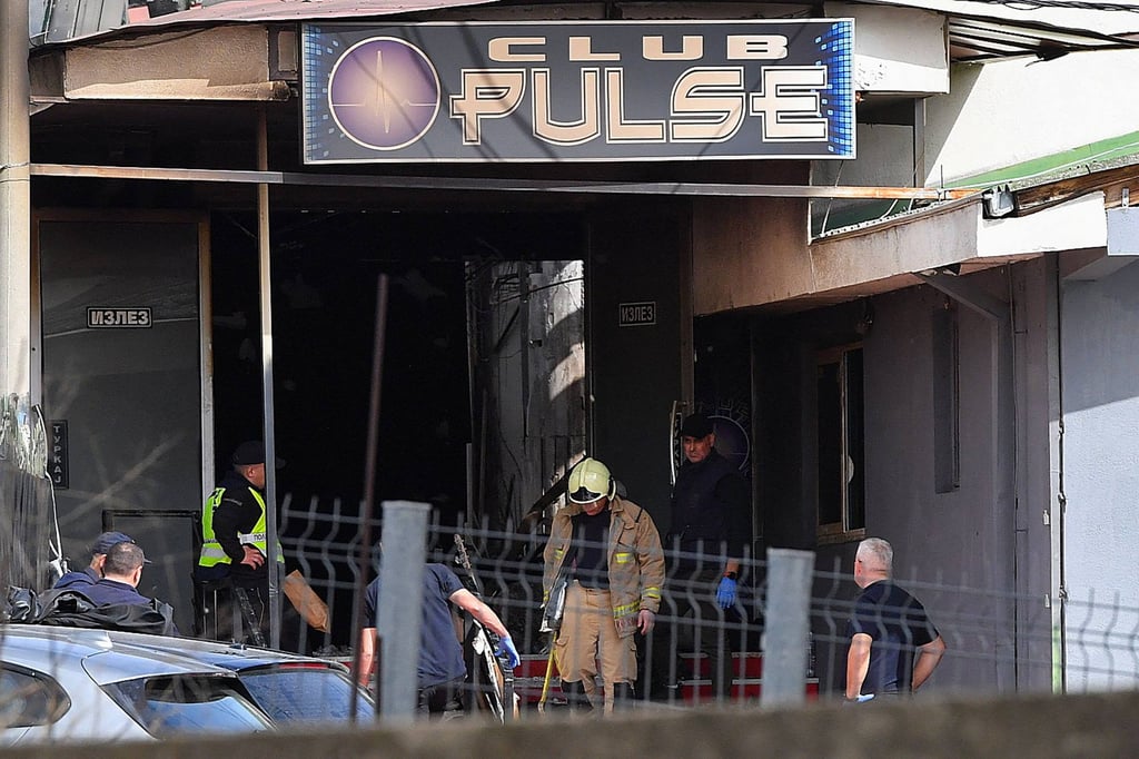 Firefighters and police officers at the scene. Photo: AFP Firefighters and police officers at the scene. Photo: AFP