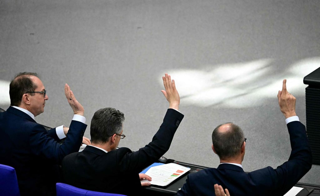 From right: Friedrich Merz, leader of Germany’s conservative CDU party, CDU parliamentary managing director Thorsten Frei and the parliamentary group leader of the Bavarian conservative Christian Social Union party Alexander Dobrindt vote during a session at the Bundestag. Photo: AFP From right: Friedrich Merz, leader of Germany’s conservative CDU party, CDU parliamentary managing director Thorsten Frei and the parliamentary group leader of the Bavarian conservative Christian Social Union party Alexander Dobrindt vote during a session at the Bundestag. Photo: AFP
