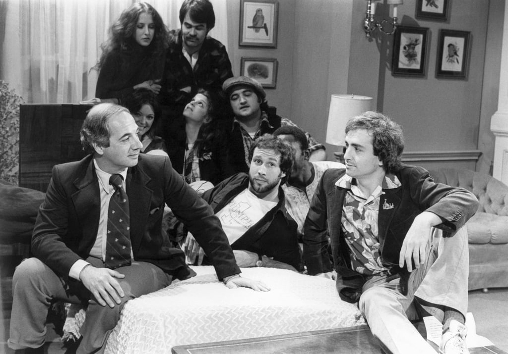 White House press secretary Ron Nessen, left, on SNL with producer Lorne Michaels, right, and cast members Chevy Chase, Laraine Newman, Dan Aykroyd, Jane Curtin, Gilda Radner, John Belushi and Garrett Morris in 1976. Photo: AP