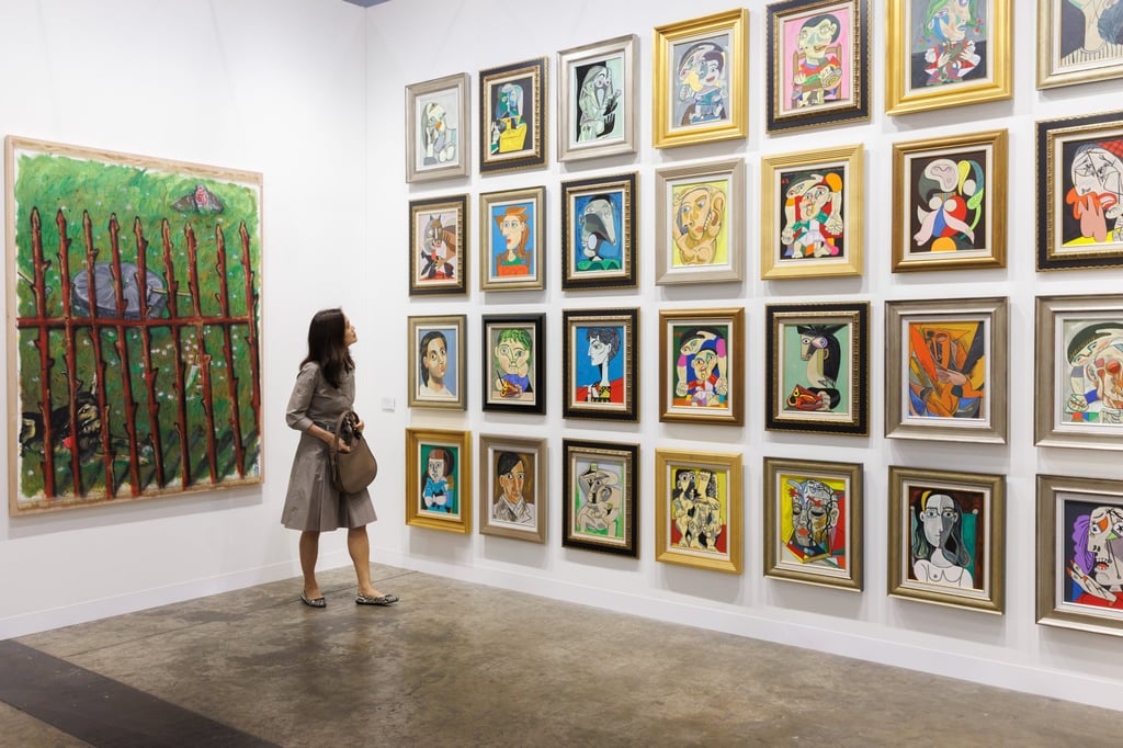 A visitor admires artworks at Art Basel Hong Kong, one of the world’s leading international art fairs. Photo: Art Basel