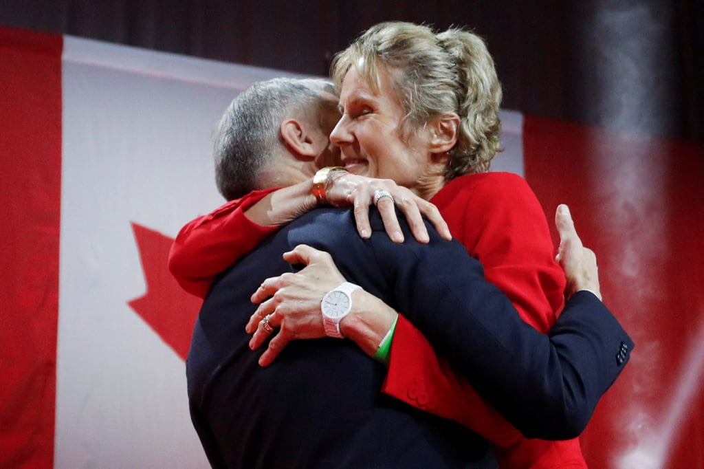 Former Bank of Canada and Bank of England governor Mark Carney and wife Diana Fox Carney embrace as he succeeds Justin Trudeau as Canadian prime minister. Photo: Reuters