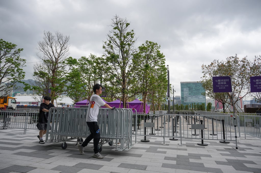 Workers outside the Kai Tak Main Stadium prepare for Day 1 of the Hong Kong Sevens. Photo: May Tse Workers outside the Kai Tak Main Stadium prepare for Day 1 of the Hong Kong Sevens. Photo: May Tse
