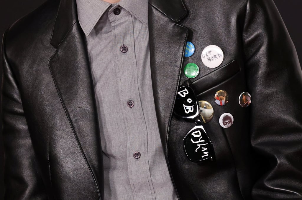 Close-up on the badges adorning Timothée Chalamet’s jacket at a premiere of the Bob Dylan biopic in December 2024. Photo: Reuters
