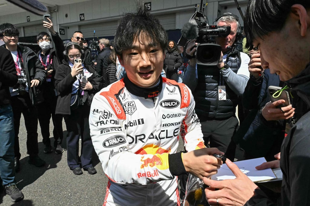 Red Bull’s Yuki Tsunoda signs autographs after his first practice run. Photo: AFP Red Bull’s Yuki Tsunoda signs autographs after his first practice run. Photo: AFP