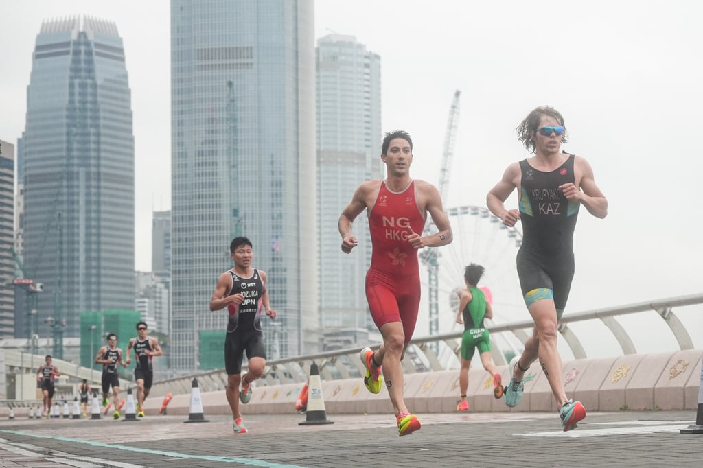 Hong Kong’s Jason Ng runs down the Victoria Harbour waterfront during the elite men’s race. Photo: Eugene Lee Hong Kong’s Jason Ng runs down the Victoria Harbour waterfront during the elite men’s race. Photo: Eugene Lee